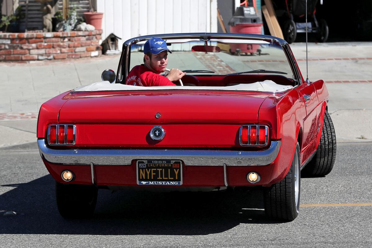 Daniel Morgan backs up his aunts 1965 Mustang 298 convertible.