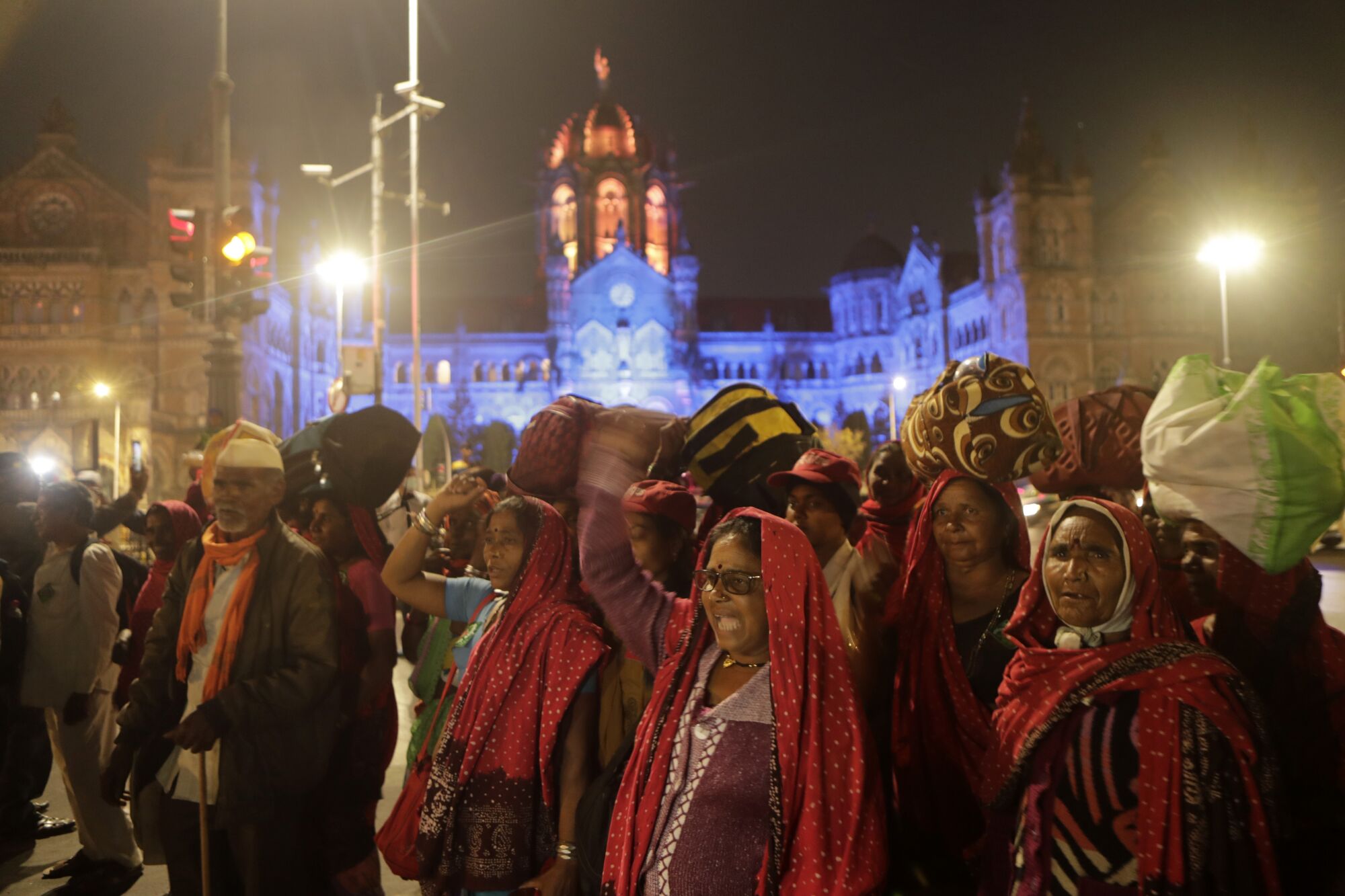 Farmers from across India's Maharashtra state arrive Sunday for a rally in Mumbai.