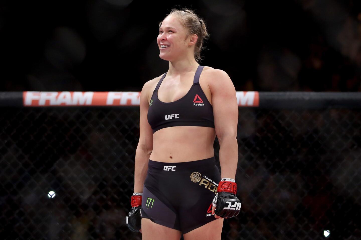 Ronda Rousey enjoys the moment after defending her UFC bantamweight belt against Bethe Correia on Saturday night.