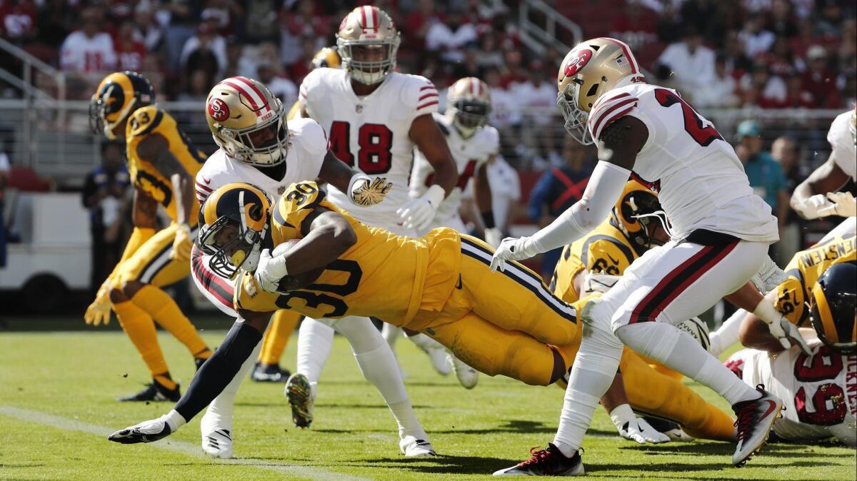 Rams running back Todd Gurley (30) scores on a 7-yard run against the San Francisco 49ers.