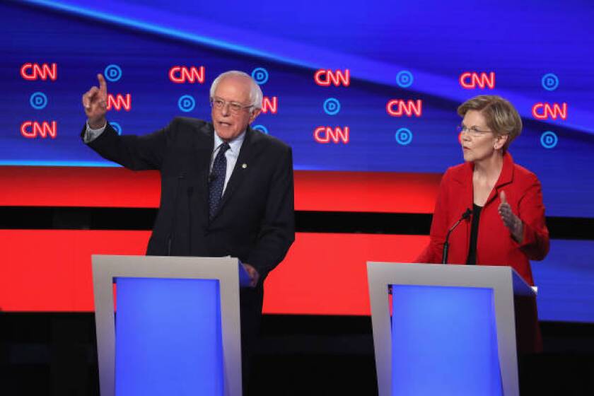 DETROIT, MICHIGAN - JULY 30: Democratic presidential candidates Sen. Bernie Sanders (I-VT) and Sen. Elizabeth Warren (D-MA) speak at the beginning of the Democratic Presidential Debate at the Fox Theatre July 30, 2019 in Detroit, Michigan. 20 Democratic presidential candidates were split into two groups of 10 to take part in the debate sponsored by CNN held over two nights at Detroit’s Fox Theatre. (Photo by Justin Sullivan/Getty Images)