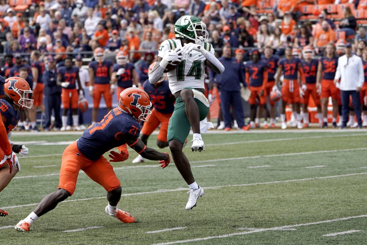 Charlotte wide receiver Grant DuBose catches a pass from quarterback Chris Reynolds, but would would turn the ball over on a fumble during the first half of an NCAA college football game against Illinois Saturday, Oct. 2, 2021, in Champaign, Ill. (AP Photo/Charles Rex Arbogast)