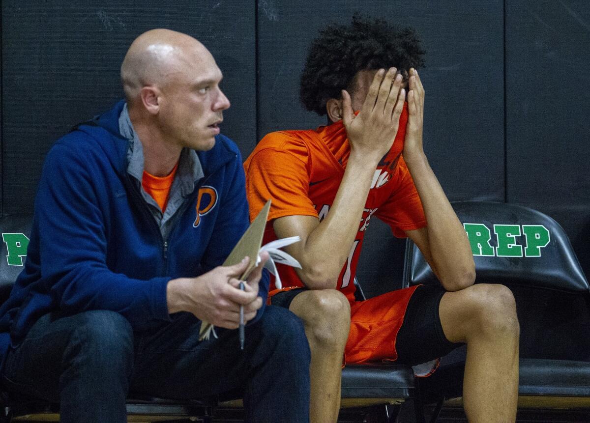 Pacifica Christian Orange County High's Houston Mallette hides his face in the final seconds of a CIF State Southern California Regional Division III quarterfinal playoff game at Fairmont Prep on Thursday.