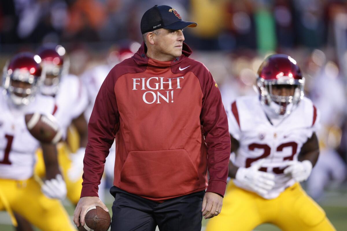 USC Interim Coach Clay Helton gets his team ready before a game against Notre Dame on Oct. 17.