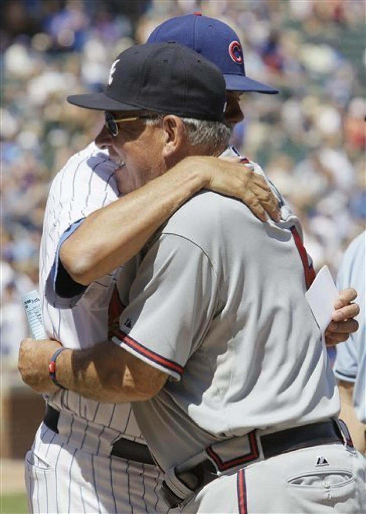 Chicago Cubs manager Lou Piniella heads to the field from the dugout before  the start of a baseball game against the Atlanta Braves, Sunday, Aug. 22,  2010, in Chicago. Piniella says he