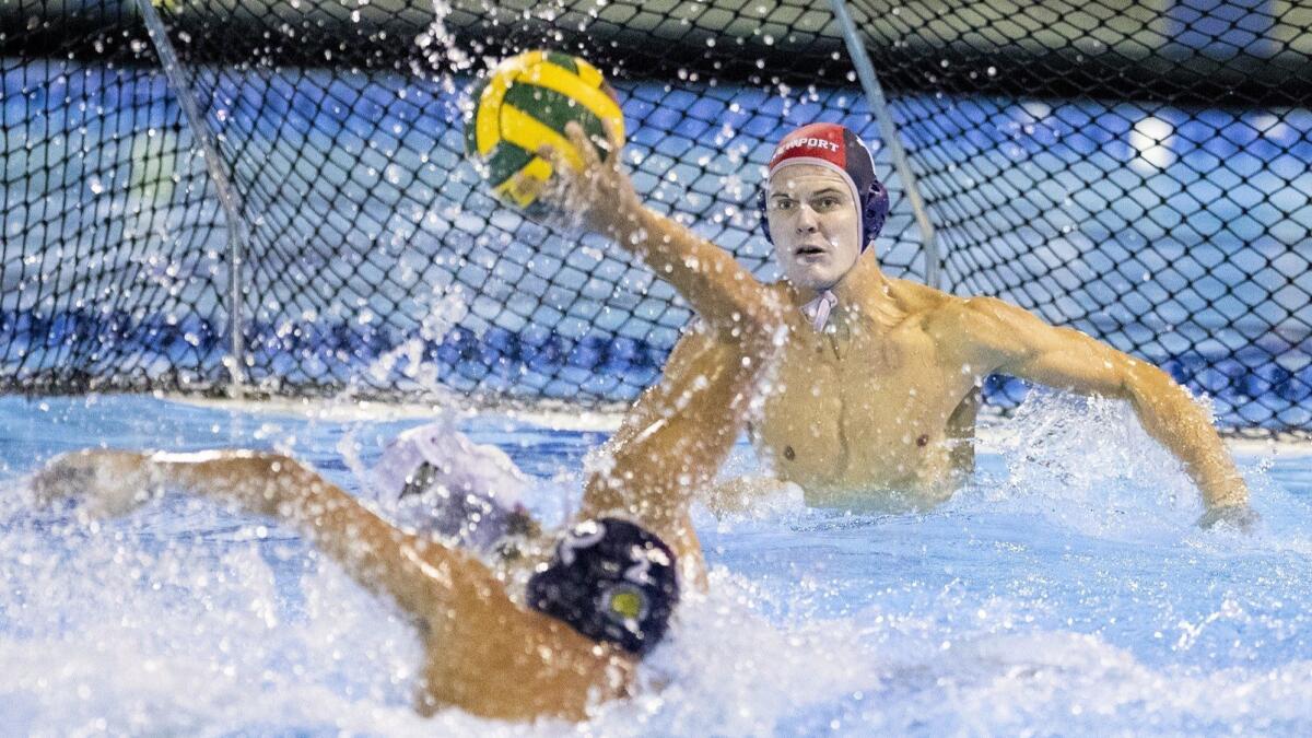 Newport Harbor High goalkeeper Blake Jackson attempts to defend a shot from Westlake Village Oaks Christian's Josh Waldoch during a CIF Southern Section Division 1 semifinal playoff game at Woollett Aquatic Center in Irvine on Wednesday.