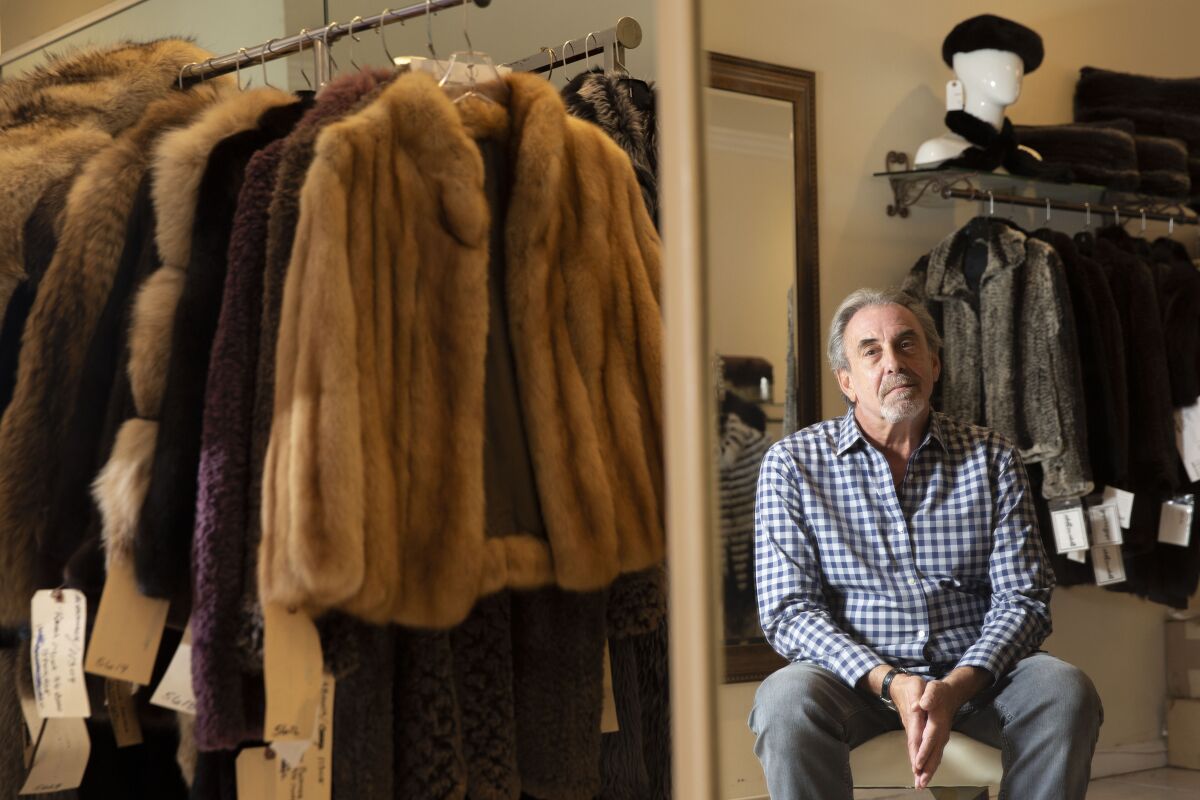 Larry Becker, owner of Dicker and Dicker of Beverly Hills, offers light, colorful furs that are popular despite the warm weather. He says a state ban on selling furs will put him out of business.