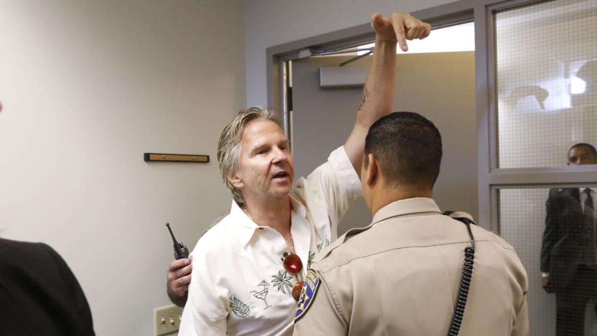 Matt Pakucko, president and co-founder of Save Porter Ranch, is ejected from a press conference where the settlement was announced.