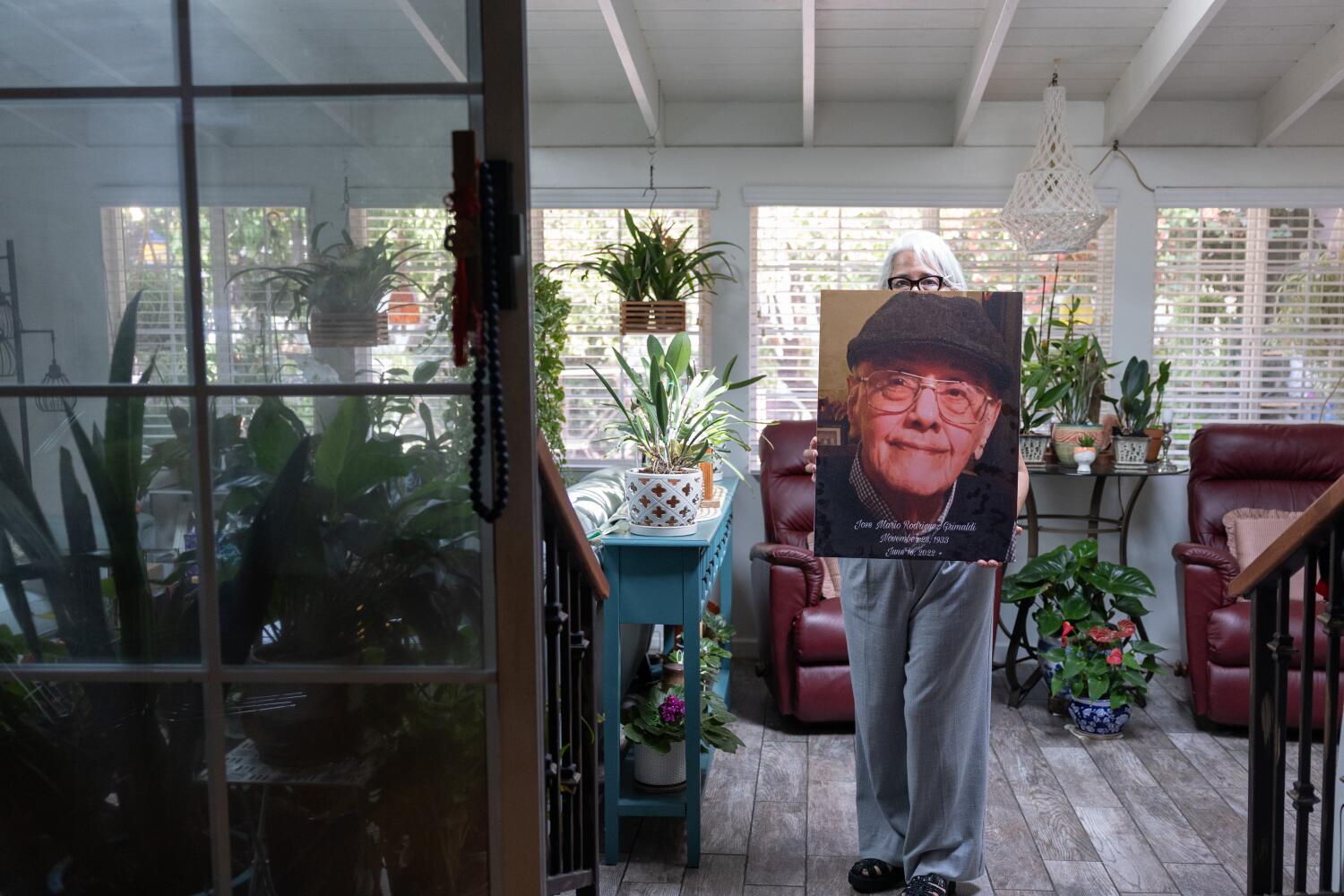 LOS ANGELES, CA - OCTOBER 02: Jose Mario Rodriguez Grimaldi died in 2022 but received two letters - one in August and another in September - for deportation. The daughter (did not want name used or full face shown) with the help of a lawyer resolved the matter. Photographed on Thursday, Oct. 2, 2025. (Myung J. Chun / Los Angeles Times)