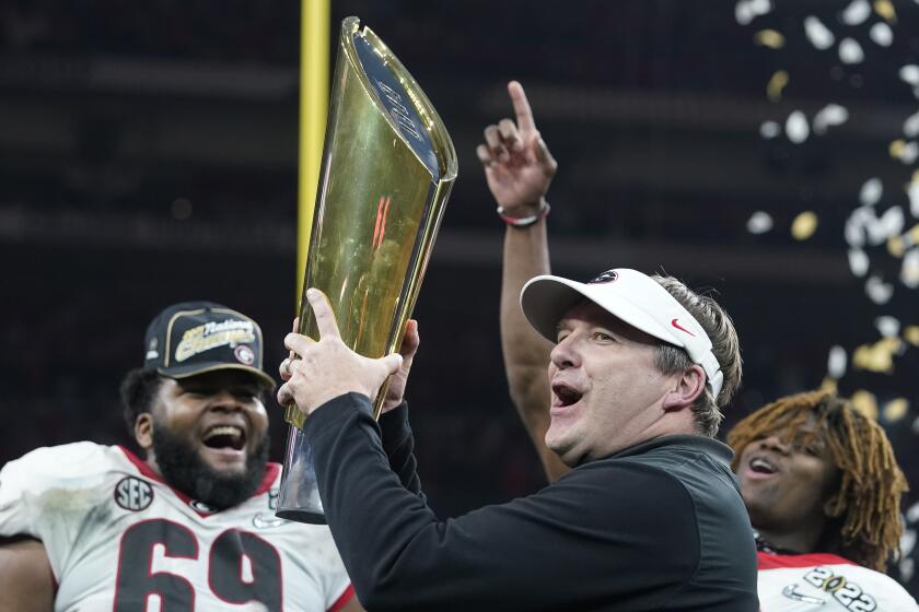 Georgia head coach Kirby Smart celebrates after the College Football Playoff championship football game against Alabama Tuesday, Jan. 11, 2022, in Indianapolis. Georgia won 33-18. (AP Photo/Darron Cummings)