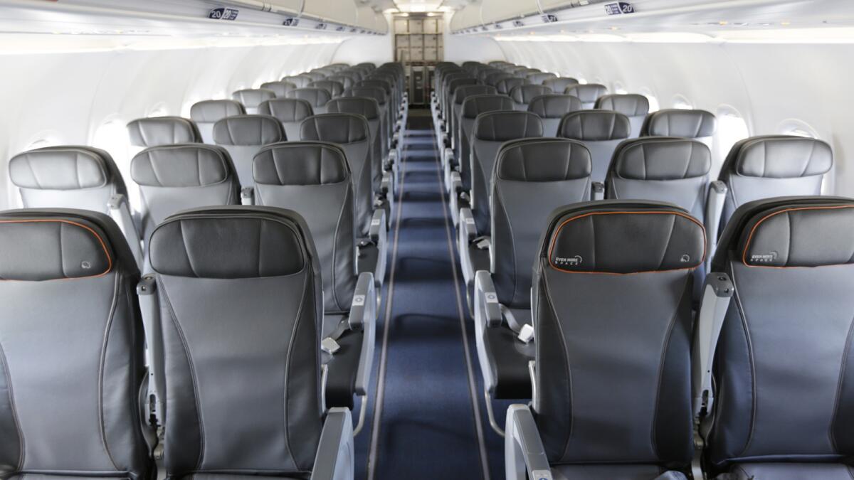 The interior of a commercial airliner at John F. Kennedy International Airport in New York.