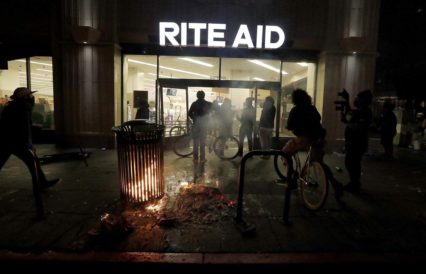People break into a Rite Aid store in downtown Los Angeles