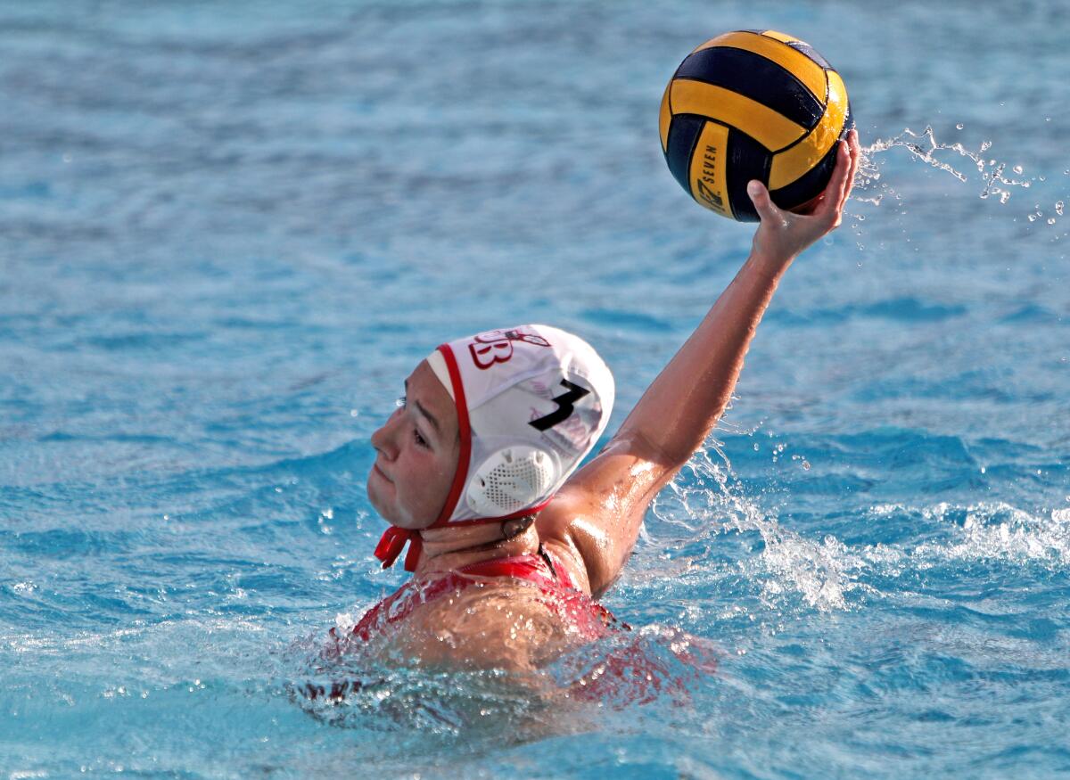 Burroughs High girls' water polo player Clarissa Robles finds herself open and scores during Wednesday's Pacific League match against Burbank.