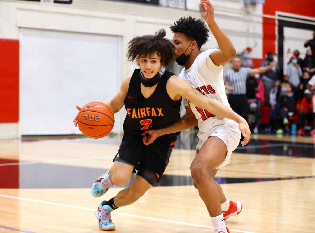 Sophomore David Mack of Fairfax tries to drive past a Westchester defender.