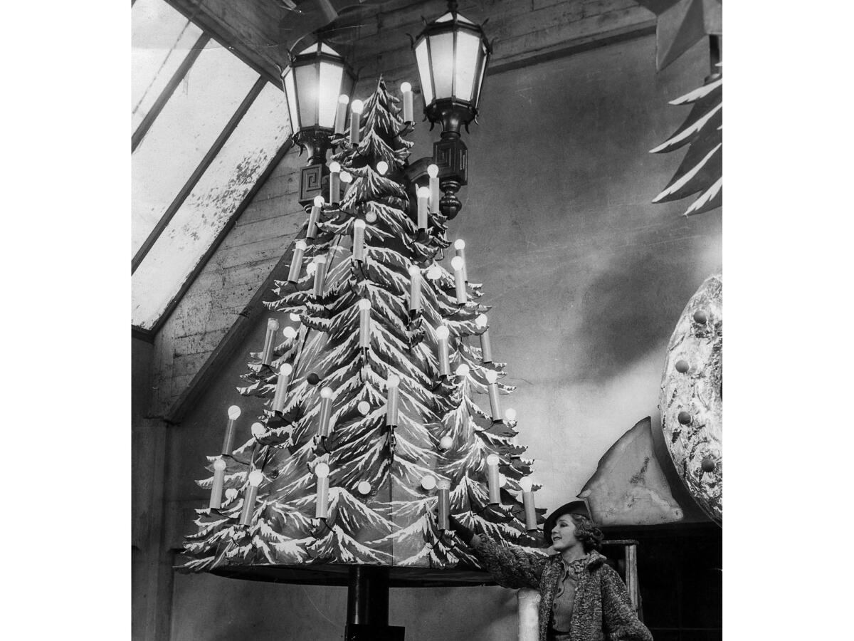 Nov. 16, 1935: Actress Mary Pickford poses next to one of the Christmas trees that would adorn Hollywood's Santa Claus Lane. In 1978, the annual Santa Claus Lane Parade became the Hollywood Christmas Parade.