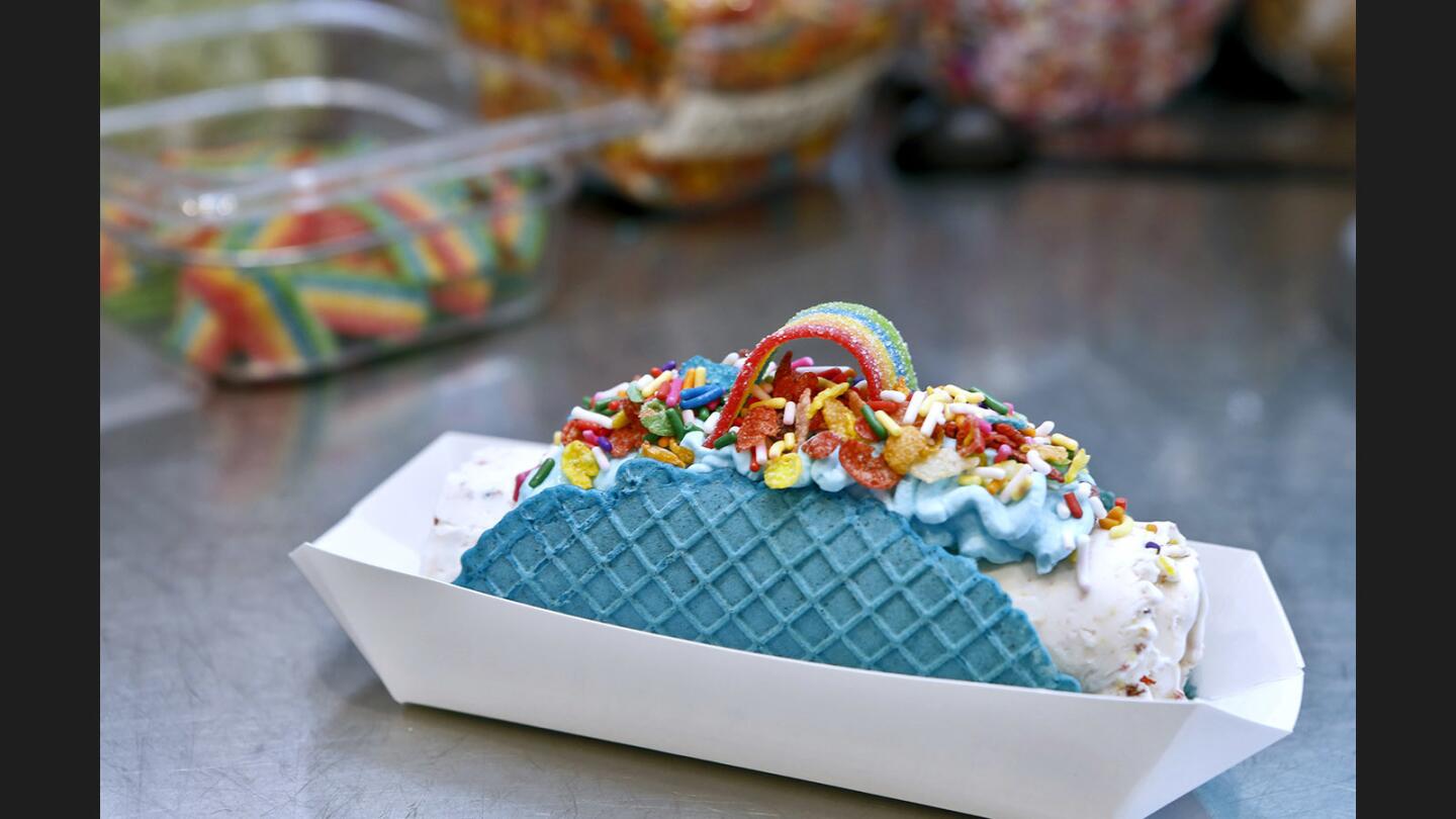The ice cream taco from Sweet Cup can be made of a variety of ingredients, including lactose-free, at 9930 Garden Grove Blvd., in Garden Grove. Owner Kenny Tran has found success marketing his sweets via Instagram. This taco was made from vanilla ice cream base, fruity pebbles, sprinkles and a strip of sweet candy.
