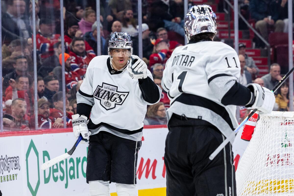 Kings forward Quinton Byfield points toward team captain Anze Kopitar after scoring against the Montreal Canadiens.