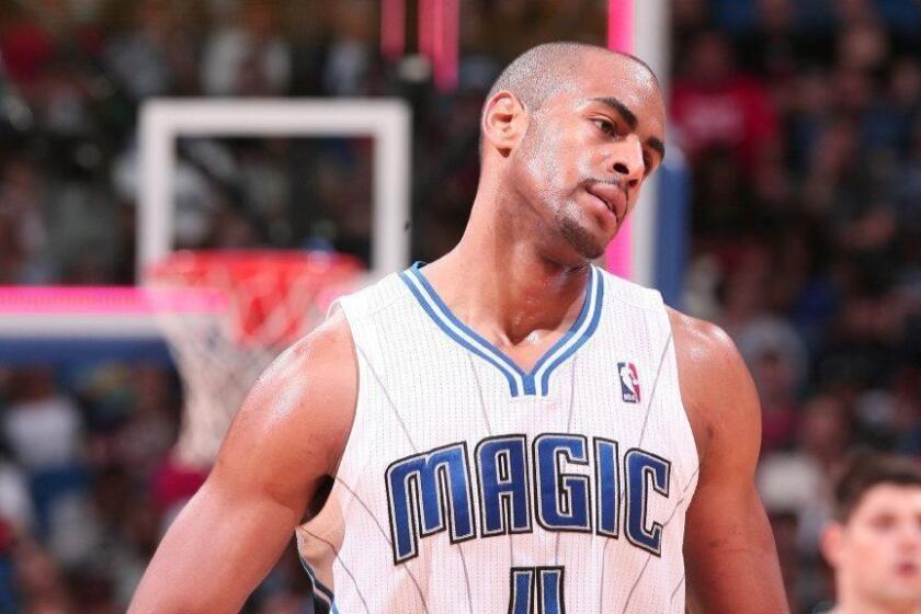 Orlando guard Arron Afflalo (4) walks off the court for a timeout out in the final minutes of the Magic's 96-94 loss to the Chicago Bulls in Orlando, Fla. Wednesday, January 2, 2013. (Gary W. Green/Orlando Sentinel) ORG XMIT: B582589861Z.1