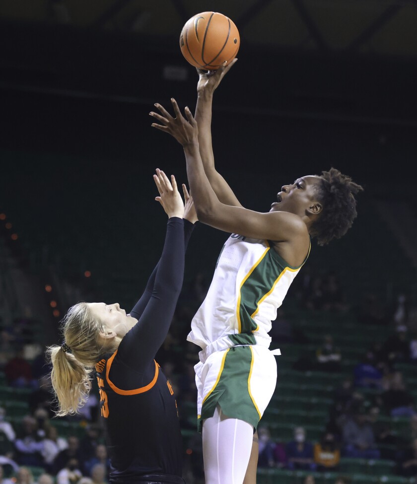 Baylor center Queen Egbo scores over Oklahoma State forward Abbie Winchester in the second half of an NCAA college basketball game, Wednesday, Jan. 19, 2022, in Waco, Texas. (Rod Aydelotte/Waco Tribune-Herald via AP)