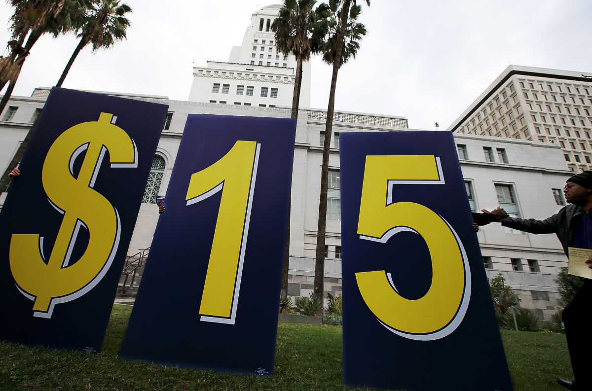 A coalition of workers, business and civic leaders rally outside Los Angeles City Hall on Jan. 30 to push for an increase to the minimum wage.