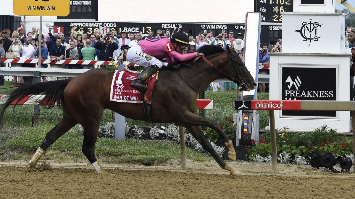War of Will, ridden by Tyler Gaffalione, crosses the finish line first to win the Preakness Stakes.