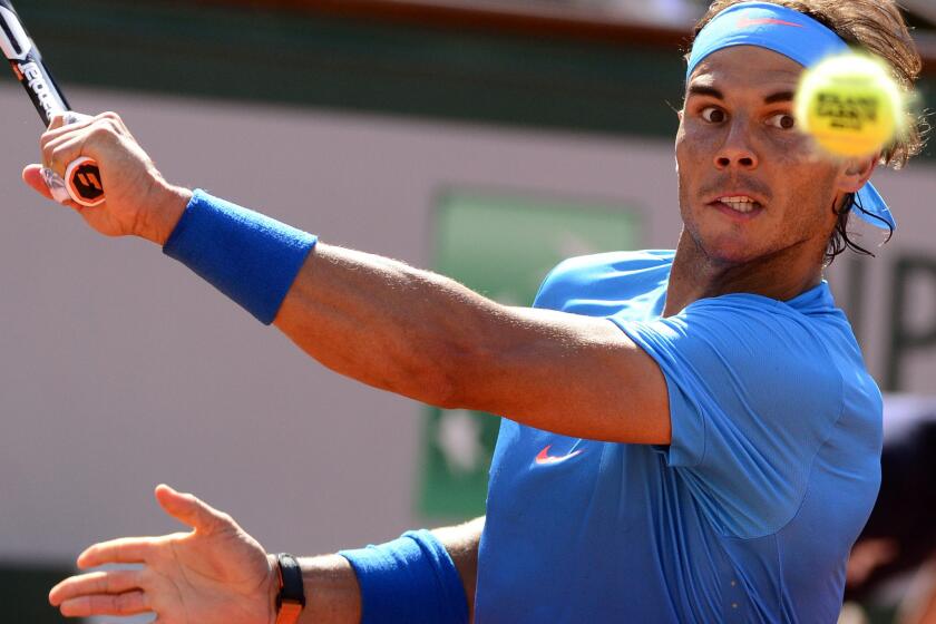 Rafael Nadal prepares to hit a backhand during his French Open quarterfinal match against Novak Djokovic on Wednesday at Roland Garros.