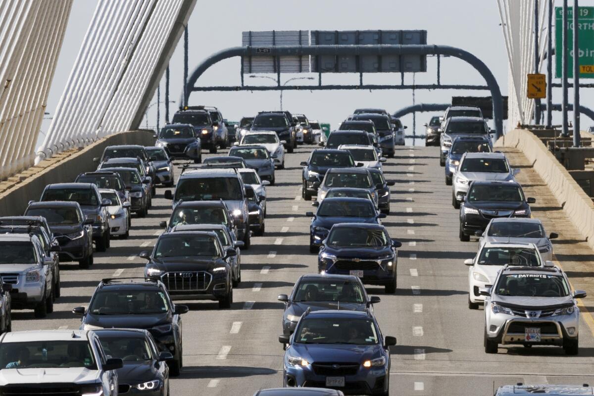 Heavy traffic heads south on Interstate 93 over the Zakim Bridge in Boston.