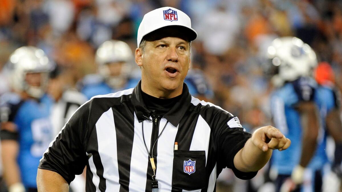 Alberto Riveron, shown making a call during a game in 2011, spent nine years as an NFL game official before moving to the league office in 2012.