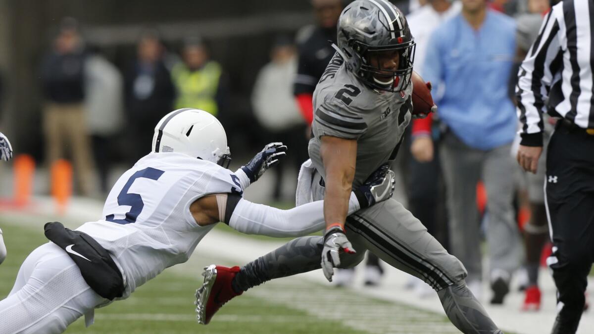 Penn State defensive back Tariq Castro-Fields, left, forces Ohio State running back J.K. Dobbins out of bounds during the first half on Oct. 28, 2017, in Columbus, Ohio. The two teams will meet this weekend in a top 10 matchup