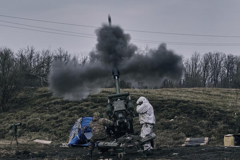 Ukrainian soldiers fire a self-propelled howitzer towards Russian positions near Bakhmut, the site of the heaviest battles, Donetsk region, Ukraine, Tuesday, March 7, 2023. (AP Photo/Libkos)