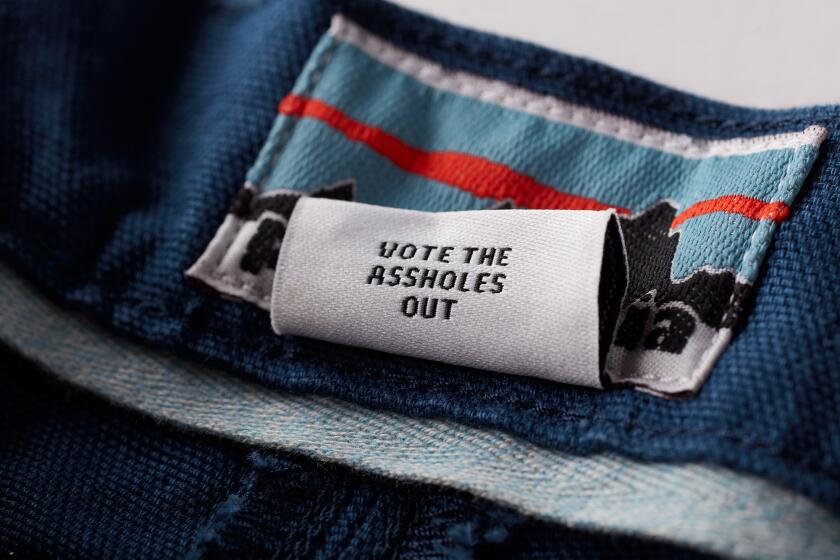 A "vote the asshole out" tag on a limited-edition pair of Patagonia's Stand Up Shorts.