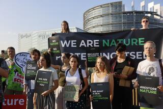 Swedish climate activist Greta Thunberg, third right, and other activists attend a demonstration outside the European Parliament, Tuesday, July 11, 2023 in Strasbourg, eastern France. Protesters and legislators are converging on the European Union parliament in Strasbourg as the bloc faces a major vote on protecting its threatened nature and shielding it from disruptive environmental change. The vote is a test of the EU's global climate credentials. (AP Photo/Jean-Francois Badias)