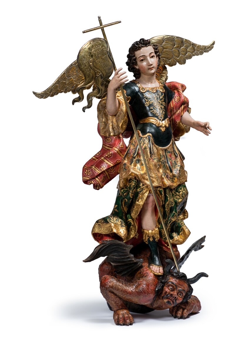 Eine Skulptur eines Heiligen und eines Teufels.