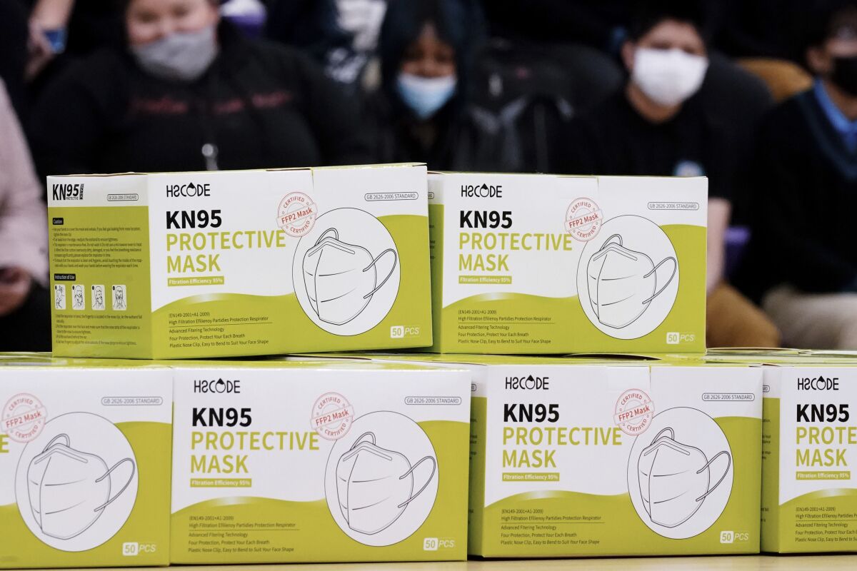 Shown are KN95 protective masks before being distributed to students at Camden High School in Camden, N.J., Wednesday, Feb. 9, 2022. As the omicron wave of the coronavirus subsides, several U.S. states including New York and Illinois ended mask mandates this week for indoor settings, while others lifted requirements at schools. (AP Photo/Matt Rourke)