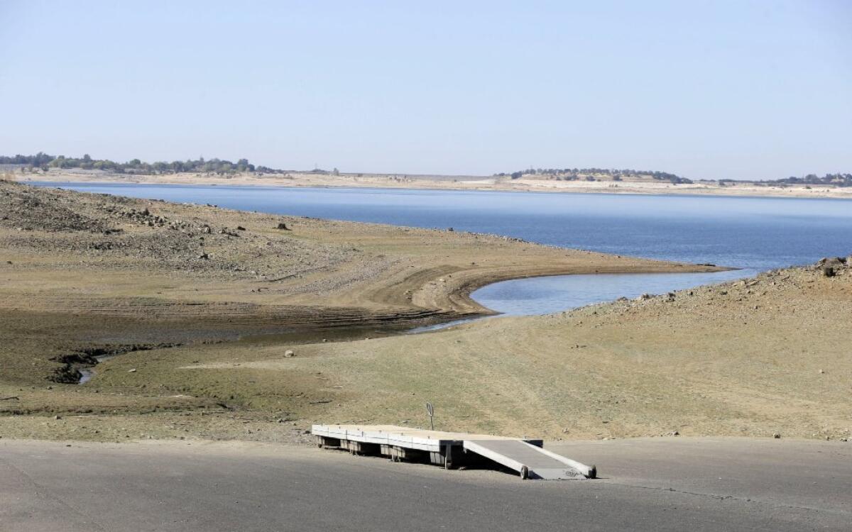 A dock sits high and dry at the end of a boat ramp yards away from the edge of Folsom Lake near Sacramento last October.