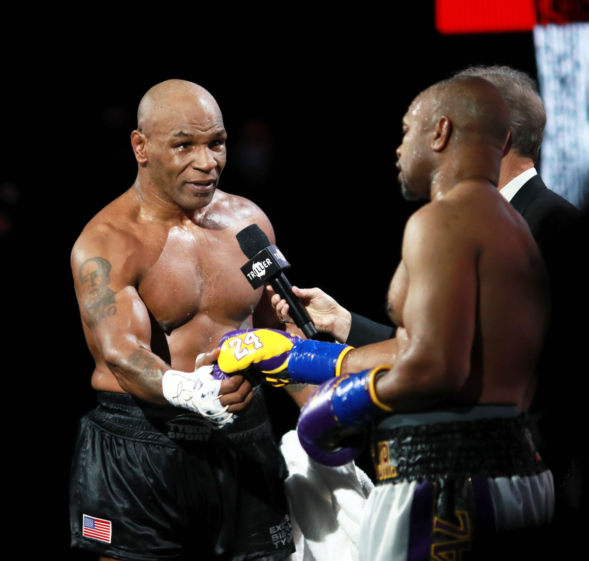 Mike Tyson, left, shakes hands with Roy Jones Jr. following their exhibition fight at Staples Center on Saturday.