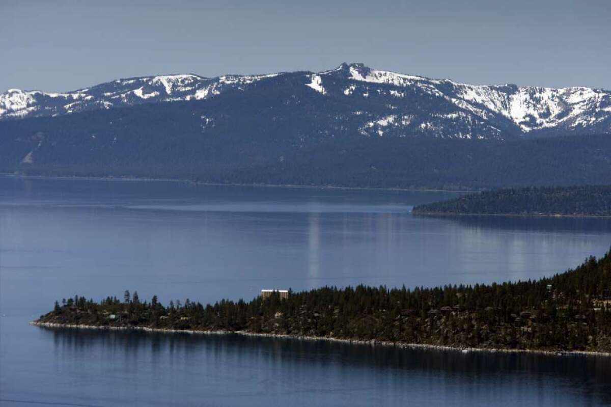 Lake Tahoe's famously clear blue waters retain their clarity, but a report warns that climate change may cause long-term harm to the lake.