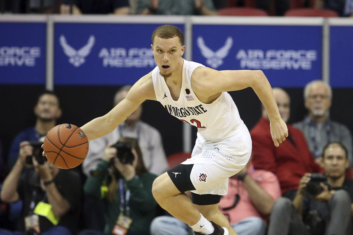 San Diego State's Malachi Flynn drives against Utah State during the Mountain West Conference tournament on March 7, 2020.