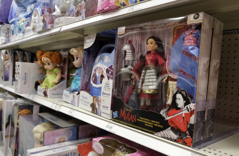 FILE - A doll based on the upcoming Walt Disney Studios film "Mulan" is displayed in the toy section of a Target department store, April 30, 2020, in Glendale, Calif. As supply chain bottlenecks create shortages on many items, some charities are struggling to secure holiday gift wishes from kids in need. They're reporting they can't find enough items in stock, or are facing shipping delays both in receiving and distributing the gifts. The founder of the organization One Simple Wish says many gift requests for gaming consoles and electronic items submitted to the charity have been out of stock. (AP Photo/Chris Pizzello, file)