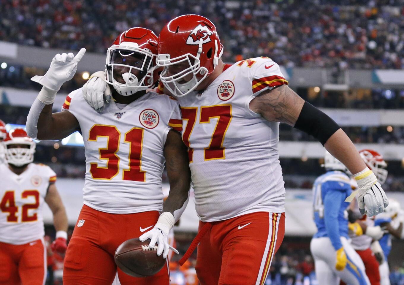 Chiefs running back Darrel Williams (31) celebrates with offensive guard Andrew Wylie after scoring a touchdown against the Chargers on Nov. 18.