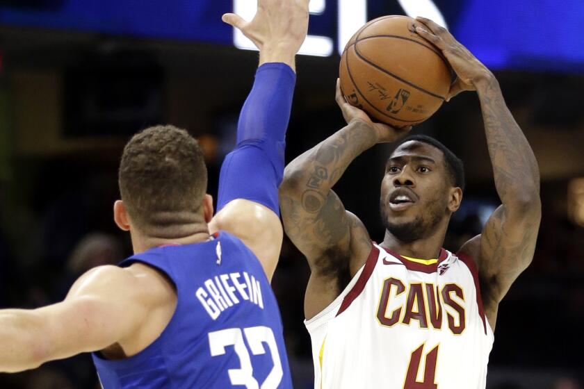 Cleveland Cavaliers' Iman Shumpert (4) shoots over Los Angeles Clippers' Blake Griffin (32) in the first half of an NBA basketball game, Friday, Nov. 17, 2017, in Cleveland. (AP Photo/Tony Dejak)