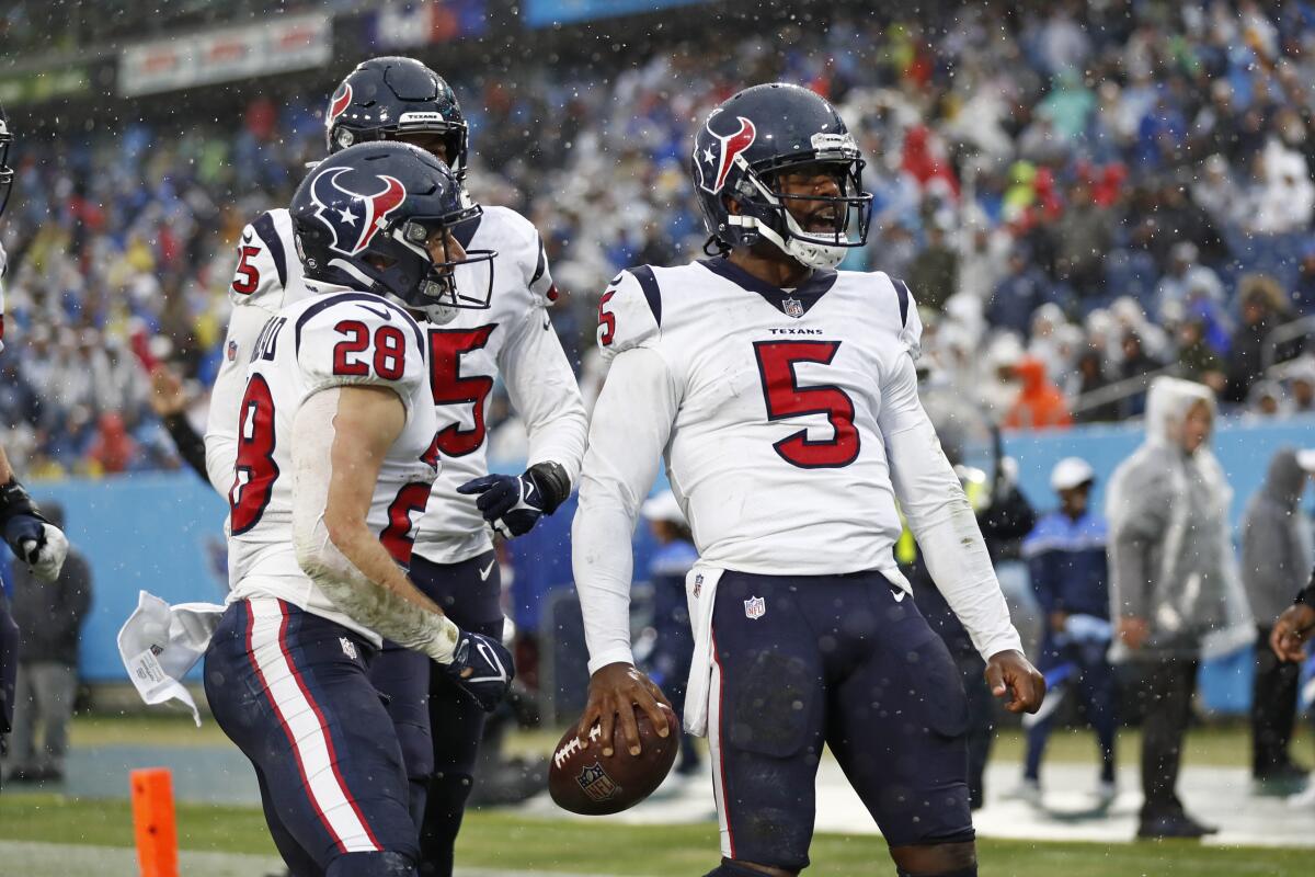 Houston Texans quarterback Tyrod Taylor celebrates after scoring a touchdown against the Tennessee Titans on Sunday.