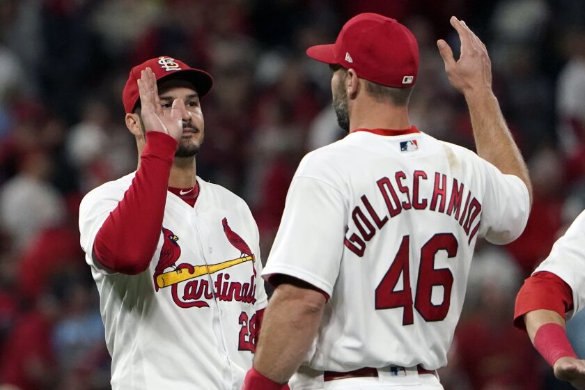 St. Louis Cardinals' Nolan Arenado, left, and Paul Goldschmidt celebrate as 2-1 victory over the Pittsburgh Pirates in a baseball game Friday, Sept. 30, 2022, in St. Louis. (AP Photo/Jeff Roberson)