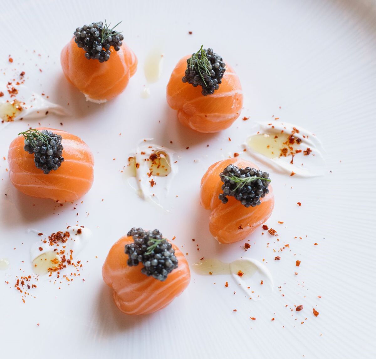 Smoked Salmon Poppers are filled with a blend of caviar, mascarpone mousse, dill and shallots.