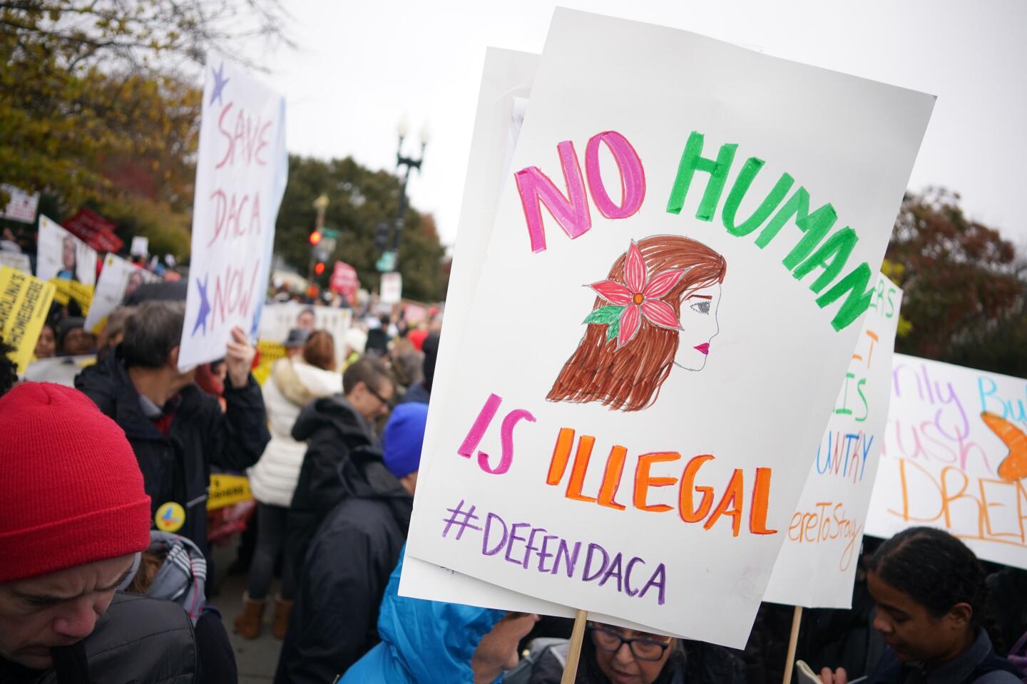 Immigration rights activists rally in front of the U.S. Supreme Court in Washington