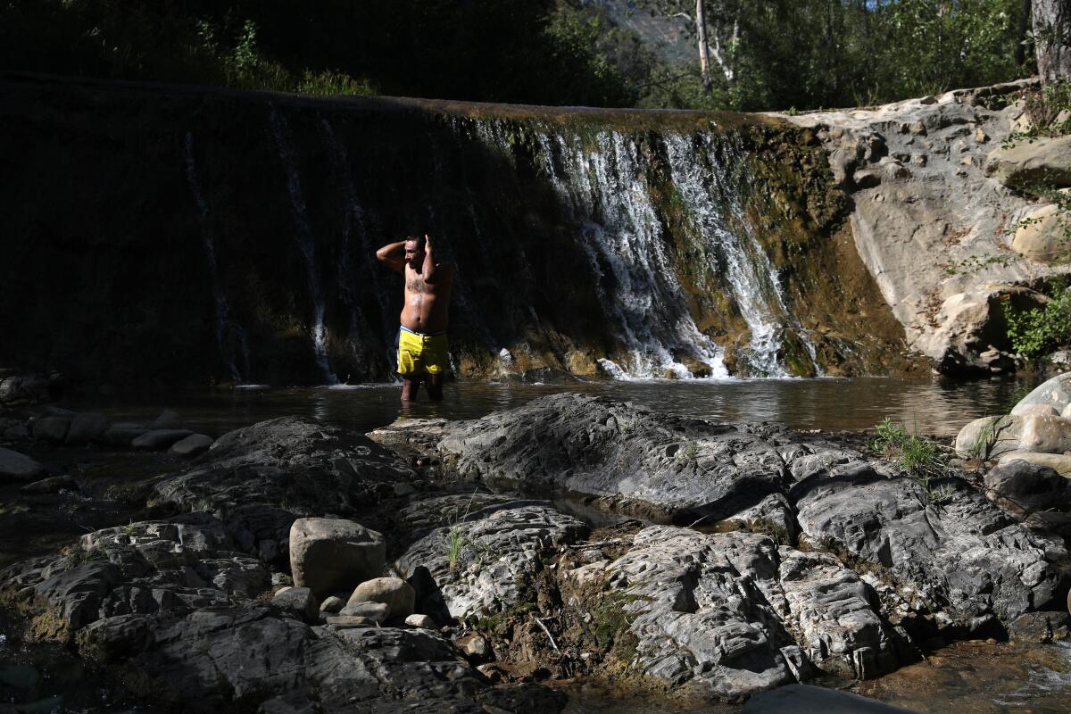 Erick Galdamez of Los Angeles cools off in the North Fork Matilija Creek at Wheeler Gorge Campground.