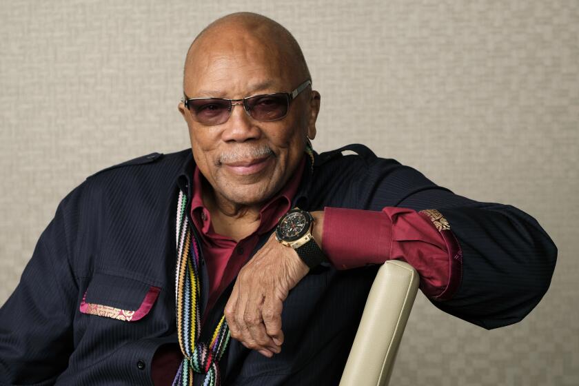 FILE - Music producer Quincy Jones poses for a portrait to promote his documentary "Quincy" during the Toronto Film Festival on Sept. 7, 2018, in Toronto. Jones will receive an honorary Oscar at the 15th annual Governors Awards in November. (Photo by Chris Pizzello/Invision/AP, File)