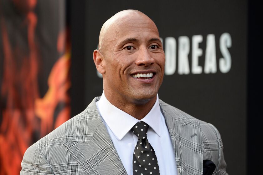 Dwayne 'The Rock' Johnson, pictured in May, has announced that one of his French bulldog puppies has died.