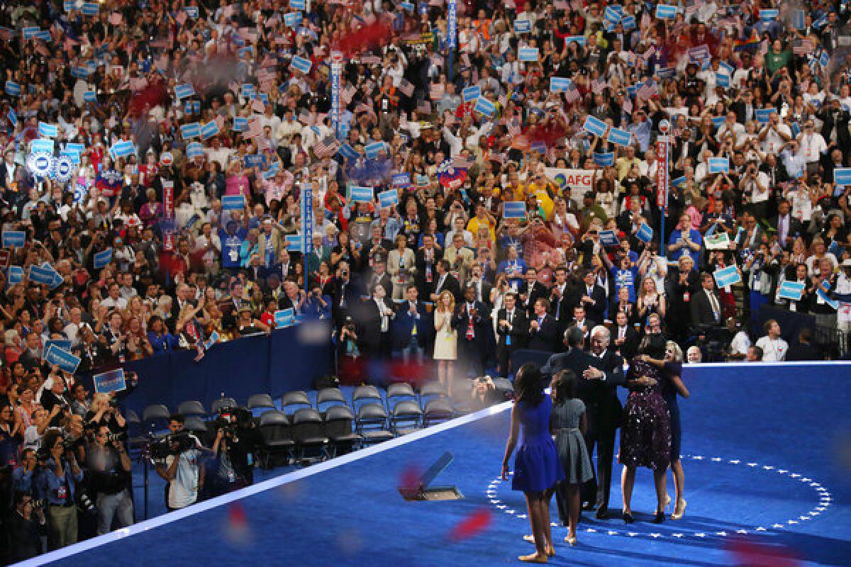 President Obama, Vice President Joe Biden and family members share the stage near the end of the Democratic National Convention.