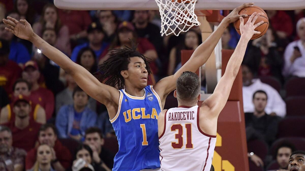 USC forward Nick Rakocevic, right, shoots as UCLA center Moses Brown defends during the second half of a Jan. 19 game.